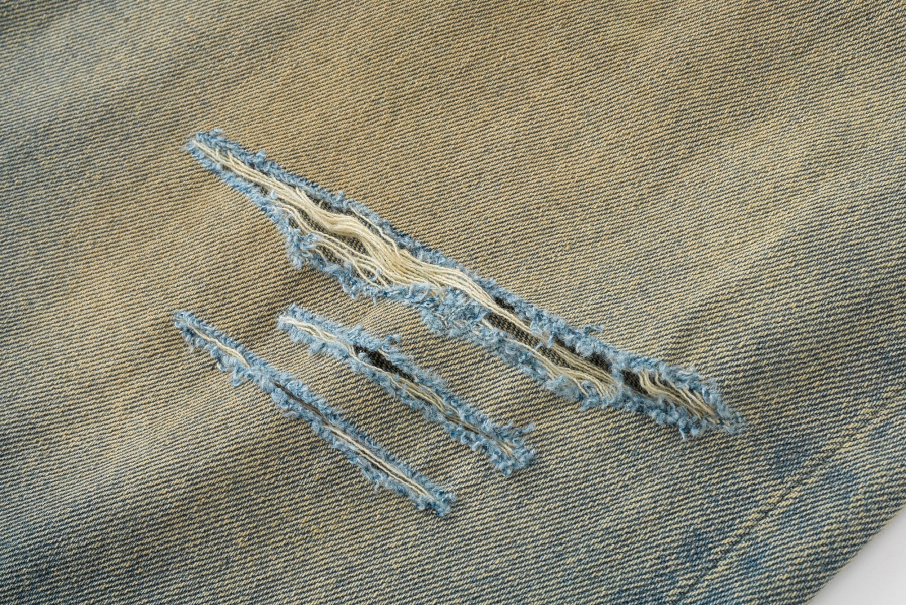 ERD Mud-Dyed Slashed Baggy Jeans